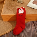 Detailed knit texture of solid red Christmas baby socks with a 3D Santa Claus figure - Red - Embroidered Santa
