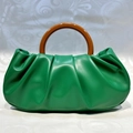 Green ruched cloud clutch bag with brown circular resin handle for evening fashion - Ruched Leather / Green