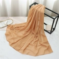 Detail view of light orange chiffon scarf hanging elegantly in a stylish lifestyle setting - 175cmx70cm / Dark Khaki
