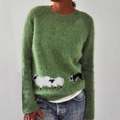Detail of green knitted sweater featuring white sheep pattern and soft fuzzy texture - S / Tops / Grass Green