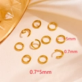 Macro shot of 0.7x5mm 18k gold plated stainless steel jump rings for jewelry making - Gold Open Jump Rings 0.7x5mm (100pcs/pack)