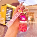 Close-up of pink My Melody keychain with liquid glitter charm and golden bell detail - Red Luminous Big Belly Cup