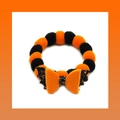 Halloween pet collar featuring orange and black plush balls with a bat wing bow accent - Orange Bow