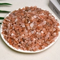 Natural orange sunstone crystal chips for decoration displayed in a white ceramic dish - Orange Sun (7-9mm) 100g