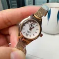Elegant rose gold women's quartz watch with mesh band and minimalist white roman dial - White Dial Gold Strap