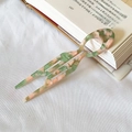 U-shaped acetate hair pin in green and pink marble texture for elegant hair styling - Fresh Green