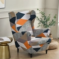 Elastic wingback chair cover featuring a modern geometric patchwork pattern in vibrant colors - Rubik's Cube