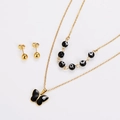 Detailed view of gold butterfly pendant necklace and evil eye bead necklace with earrings - Gold Black