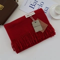 Red cashmere-style scarf with tassels and brand tag, styled with a leather bag - Wine Red / 200cm