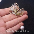 Golden alloy butterfly brooch with amber wings, rhinestones and a hanging white pearl - Style 87/Amber Pearl Rhinestone