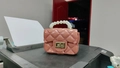 Pink mini PVC jelly bag with quilted pattern, pearl handle, and golden metal lock clasp - Deep Pink