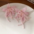Detail of pink tulle flower earrings with crystal beads and gold tassels on a ceramic tray - 30# Ear Buckle - Pink - Flower