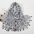 Close-up of ink floral print scarf with soft gray tassel fringe and lightweight texture - White Base Gray Ink Floral Style (XB953)