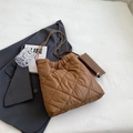 Brown quilted tote bag with chain strap and small pouch on a stylish grey blazer - Khaki