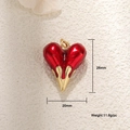 Detail view of a 26mm red enamel heart pendant with gold dripping edge and dimensions - Large 3D Heart