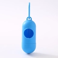 Close-up of blue capsule-shaped pet waste bag dispenser with a hook for easy attachment - Pill Dispenser / Blue
