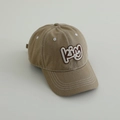 Detail of 3D embroidered KING text on vintage washed denim kids baseball cap - Letter KING / Khaki