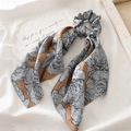 Camel satin ponytail hair tie with blue floral print and long streamers on white cloth - Coffee Satin Floral