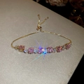 Detail of pink and white zircon stones on a gold-plated adjustable slider bracelet - 51# Gold Pink Tennis Style