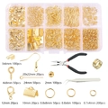 Golden DIY jewelry making kit with beads, lobster clasps, hooks, and pliers in a storage box - Gold Findings + Tools