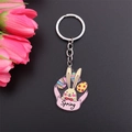 Detail of Easter bunny keychain with Spring banner and colorful enamel painted eggs - Letter Rabbit