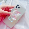 Close-up of a 3D colorful iridescent bear phone socket with white cloud motif - Expanding Stand / Iridescent Cloud Bear