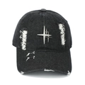 Close-up of a distressed black denim baseball cap with silver metal star and rivets detail - Adjustable / Black