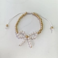Elegantes Perlenarmband mit weißer Perlerschleife und verstellbarer weißer Kordel - Goldene Perlen Weiße Perle Schleife Verstellbares Armband (N-1113)