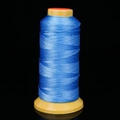 Bright blue braided polyester cord roll on yellow spool for jewelry making - Light Blue