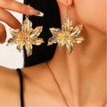 Golden flower earrings with clear rhinestone center and wrinkled texture on a female model - Gold Rhinestone Flower Earrings (Z-069)