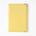 Yellow faux leather passport holder with silver letter printing and metal corners - Yellow
