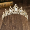 Close-up of golden bridal tiara with clear crystals on a rustic wooden background - Gold + White Rhinestone