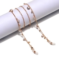 Catena per occhiali dorata con perle bianche e strass su un supporto cilindrico - Oro (Stile Perle e Strass)