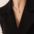 Silver necklace with oval white stone pendant and rhinestones on model with black blazer - Silver White Turquoise Necklace