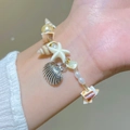 Bracciale in cristallo bohémien multistrato con ciondoli stella marina e conchiglia - Stella Marina Gialla Argento Antico (32 Argento Antico Giallo 4129)