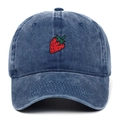 Close-up detail of strawberry embroidery on vintage washed blue denim baseball cap - Navy Blue