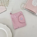Detailed close-up of pink fabric coin purse with silver stars and blue heart button - Pink