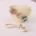 Close-up of handmade straw crossbody bag with three colorful fabric flowers - Jeweled Flower Style / Cream