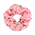 Detailed macro view of pink Christmas scrunchie with Santa and snowman cartoon patterns - Pink