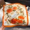 Close-up of elegant floral print silk scarf with orange and beige contrast patterns - 70*70cm / Orange Red Contrast Floral