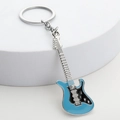 Macro detail of a blue and black electric guitar keychain with metal key ring - Sapphire Blue