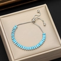 Detailed shot of silver bracelet with blue rectangular stones and adjustable slider clasp - Aqua