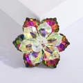Detailed close-up of luxury crystal flower brooch with vibrant AB rainbow coating - Purple
