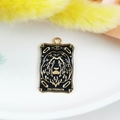 Golden Strength tarot card charm with black enamel inlay for DIY jewelry design - The Strength