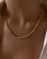 Close-up of a two-tone Cuban chain necklace with sparkling white zircons in 18k gold plating - Necklace