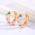 Macro shot of pink enamel flower hoop earrings with intricate gold floral details - Pink (Copper)
