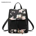 Fashionable black leather backpack for women featuring white floral and butterfly prints - Flower Black