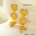 Detailed view of gold heart earrings showing dimensions 5.6cm and hammered metal texture - Hammered Triple Hearts (NMSE-C847-2)