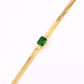 Macro detail of 18k gold plated snake chain necklace with rectangular green gemstone - Green Zirconia
