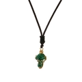Macro detail of wire-wrapped green stone mushroom pendant on brown woven cord - Malachite Gold